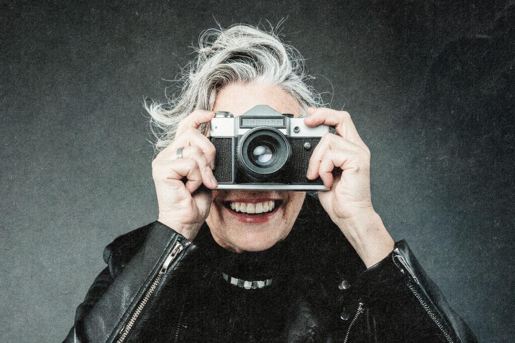 elderly woman with camera