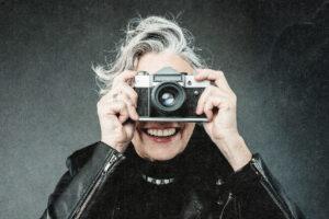 elderly woman with camera