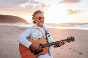 elderly man with guitar