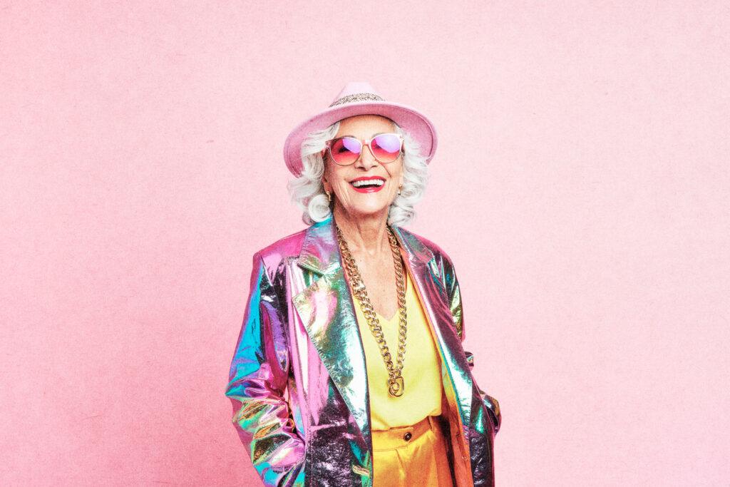 happy, bright coloured elderly woman